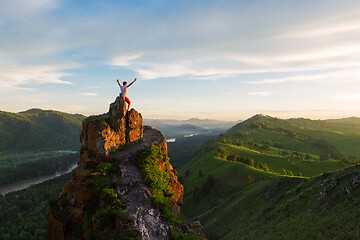 Image showing Man standing on top of cliff