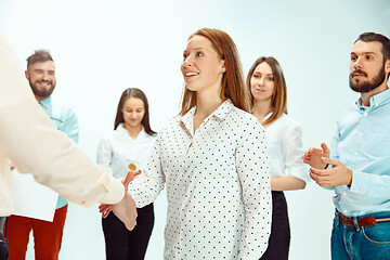 Image showing Boss approving and congratulating young successful employee