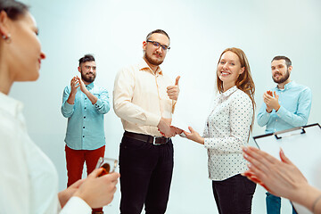 Image showing Boss approving and congratulating young successful employee