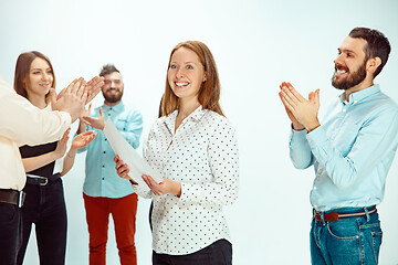 Image showing Boss approving and congratulating young successful employee