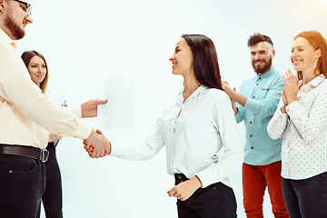 Image showing Boss approving and congratulating young successful employee