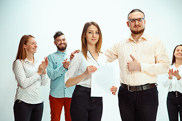 Image showing Boss approving and congratulating young successful employee