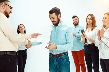 Image showing Boss approving and congratulating young successful employee