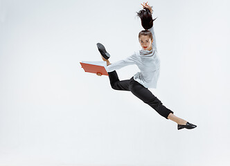 Image showing Happy business woman dancing and smiling isolated on white.