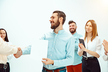 Image showing Boss approving and congratulating young successful employee