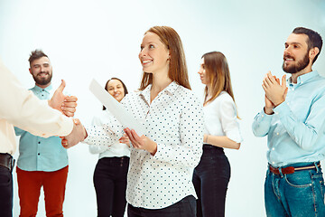 Image showing Boss approving and congratulating young successful employee