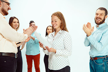 Image showing Boss approving and congratulating young successful employee