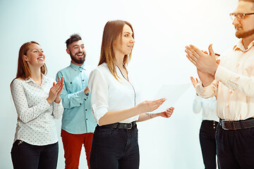 Image showing Boss approving and congratulating young successful employee