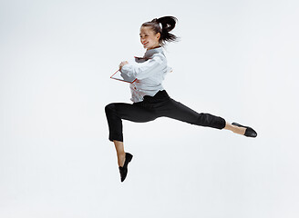 Image showing Happy business woman dancing and smiling isolated on white.