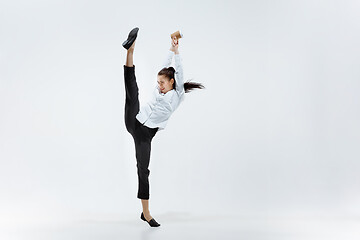 Image showing Happy business woman dancing and smiling isolated on white.