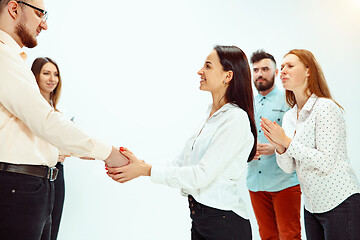 Image showing Boss approving and congratulating young successful employee