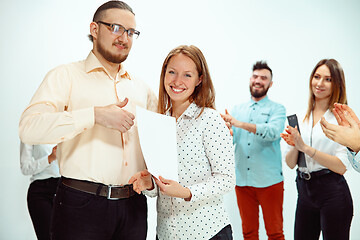 Image showing Boss approving and congratulating young successful employee