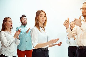 Image showing Boss approving and congratulating young successful employee