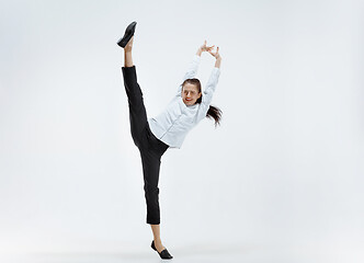 Image showing Happy business woman dancing and smiling isolated on white.