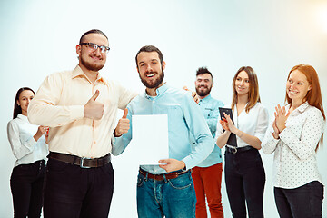 Image showing Boss approving and congratulating young successful employee