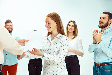 Image showing Boss approving and congratulating young successful employee