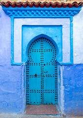 Image showing Old blue door on street in Chefchaouen