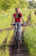 Image showing Cute young girl on bicycle