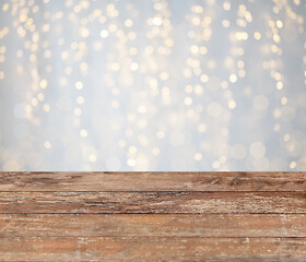 Image showing empty wooden table with christmas golden lights