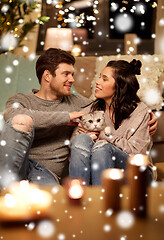 Image showing happy couple with cat at home