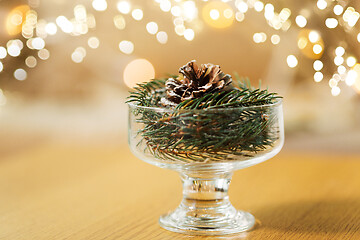 Image showing christmas fir decoration with cone in dessert bowl
