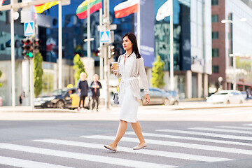 Image showing asian woman with takeaway coffee cup in city