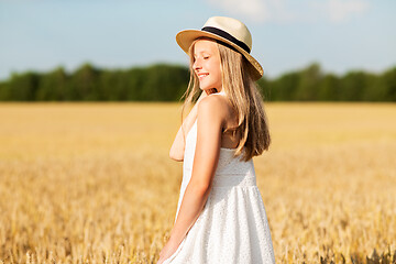 Image showing portrait of girl in straw hat on field in summer