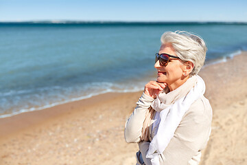 Image showing portrait of senior woman in sunglasses on beach