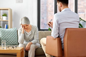 Image showing sad senior woman patient and psychologist