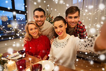 Image showing friends taking selfie at christmas dinner