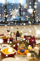 Image showing food and drinks on christmas table at home