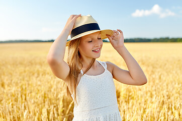 Image showing portrait of girl in straw hat on field in summer