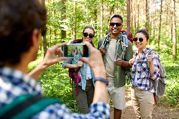 Image showing friends with backpacks being photographed on hike