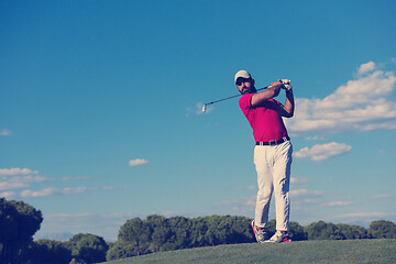 Image showing golf player hitting long shot