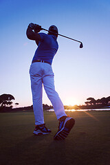 Image showing golfer hitting long shot