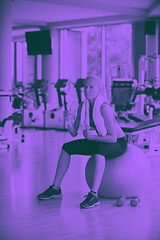 Image showing woman in fitness gym drink water