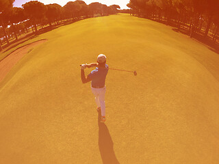 Image showing top view of golf player hitting shot