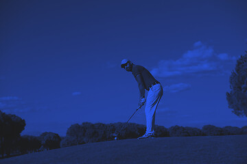 Image showing golf player hitting long shot