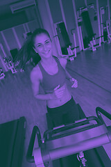 Image showing woman exercising on treadmill in gym