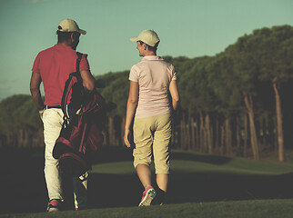 Image showing couple walking on golf course