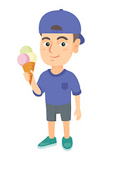 Image showing Little caucasian boy holding an ice cream cone.