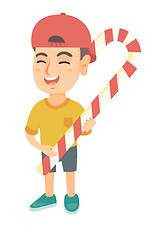 Image showing Caucasian little boy holding christmas candy cane.