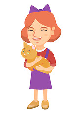 Image showing Caucasian happy girl holding a cat.