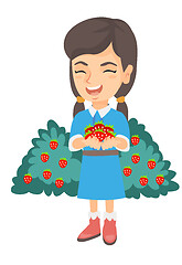 Image showing Caucasian girl holding fresh strawberries in hands