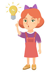 Image showing Caucasian little girl pointing at the lightbulb.