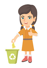 Image showing Little girl throwing banana peel in recycling bin.