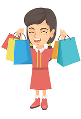 Image showing Happy caucasian girl holding shopping bags.