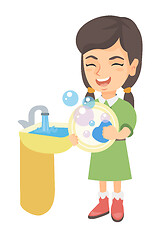 Image showing Little caucasian girl washing dishes in the sink.