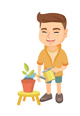 Image showing Caucasian boy watering plant with a watering can.