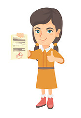 Image showing Pupil holding a sheet with the highest mark.